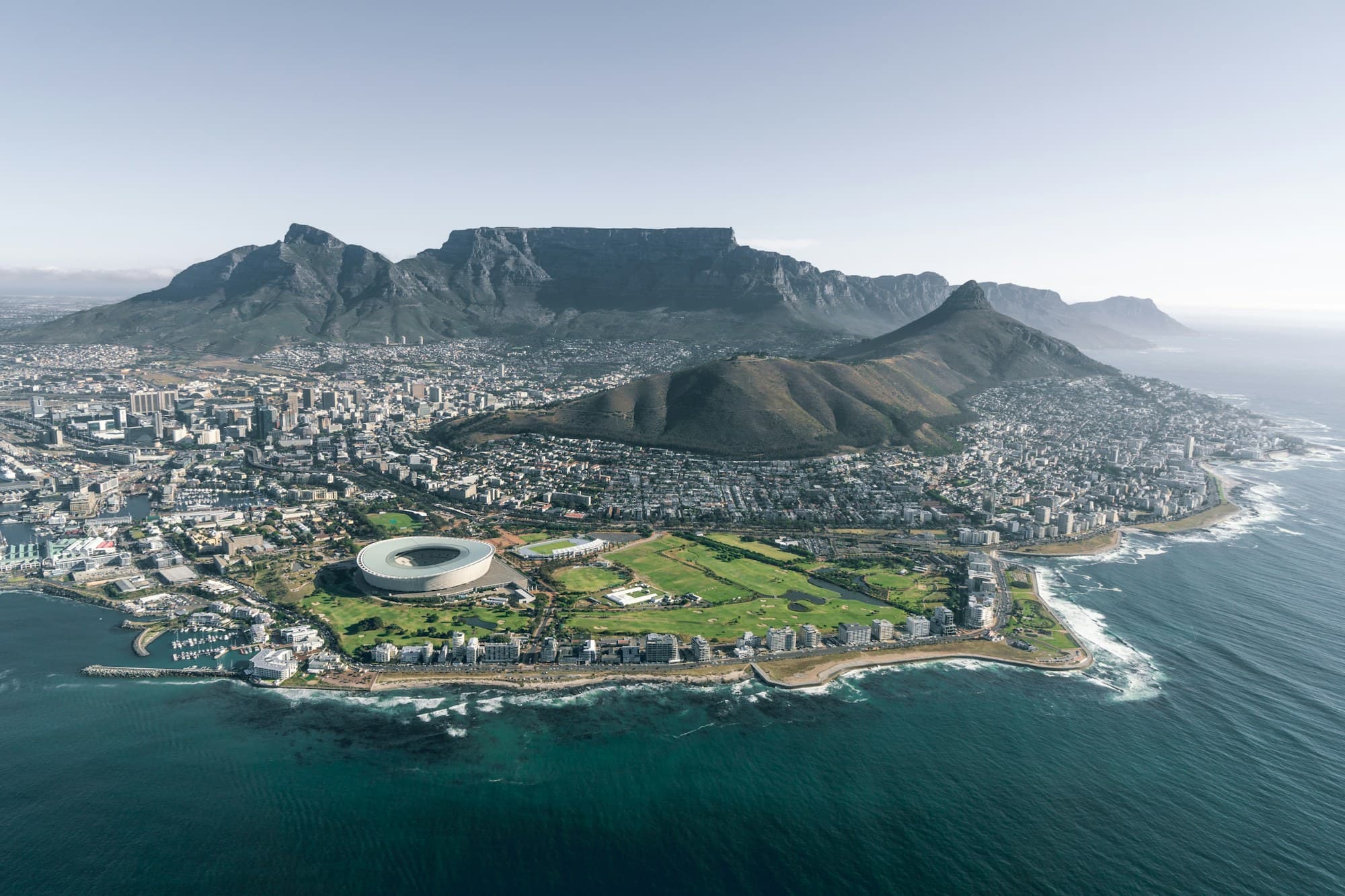 Table Mountain and the Cape Town coastline seen from above at dusk